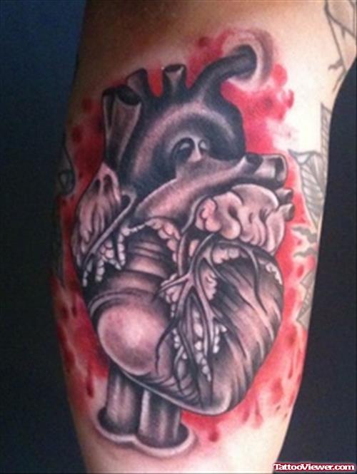 Grey Ink Human Heart Tattoo