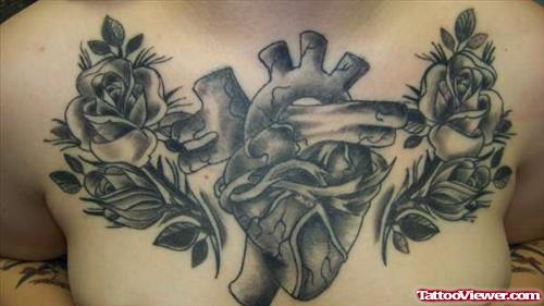 Grey Ink Flowers and Heart Tattoo On Man Chest