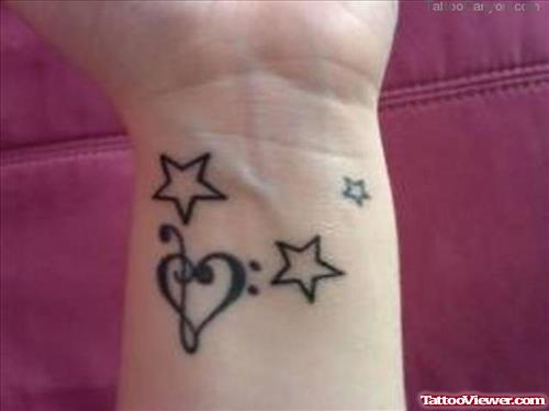 Stars and Heart Tattoo On Left Wrist