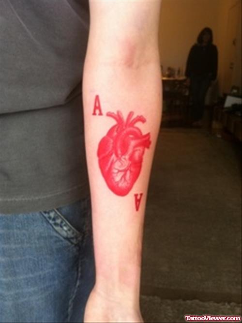 Red Heart Tattoo On Left Forearm
