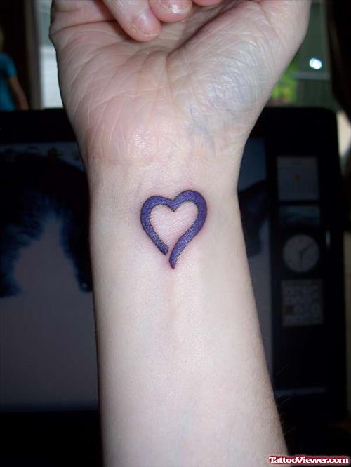 Purple Ink Heart Tattoo On Right Wrist