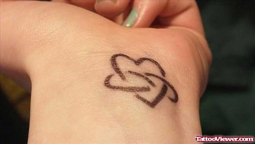 Black Ink Heart Tattoo On Left Wrist