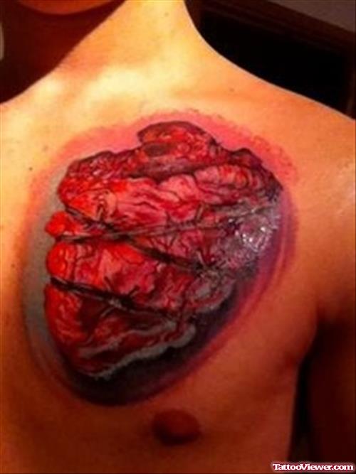 Awesome Red Ink Human Heart Tattoo On Chest