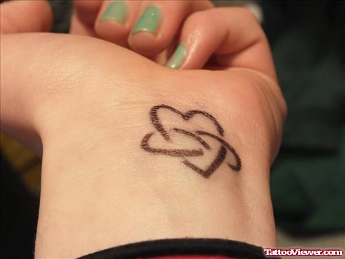 Infinity Symbol And Heart Tattoo On Left Wrist