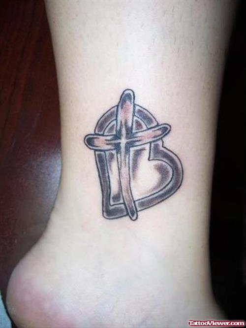 Grey Ink Cross and Heart Tattoo On Ankle