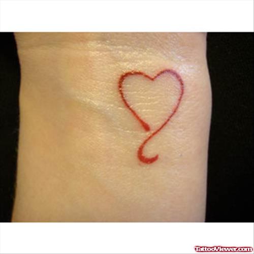 Tiny Red Heart Tattoo