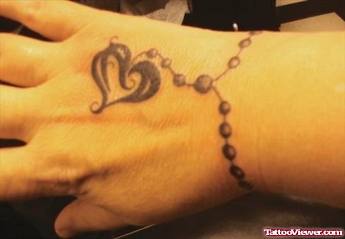 Rosary Heart Tattoo On Right Wrist