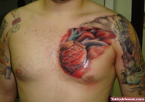 Red Heart Tattoo On Man Chest
