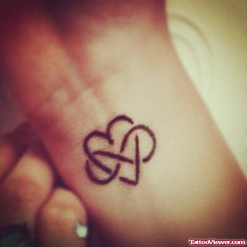 Infinity Symbol and Heart Tattoo On Wrist