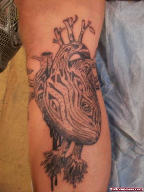 Grey Ink Heart Tattoo On Bicep