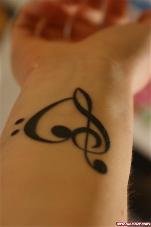 Black Ink Music Heart Tattoo On Wrist