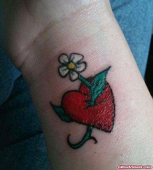 White Flower And Red Heart Tattoo On Wrist