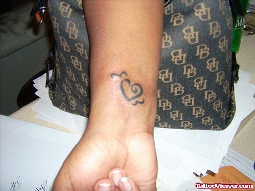 Tribal Heart Tattoo On Right Wrist