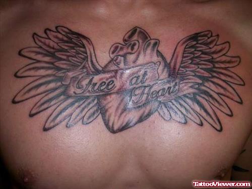 Grey Ink Winged Heart Tattoo On Chest