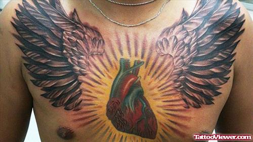 Awesome Winged Heart Tattoo On Chest