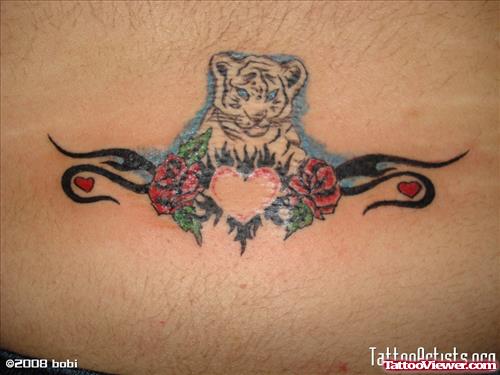Awesome Tribal and Rose Flowers With Heart Tattoo On Lowerback