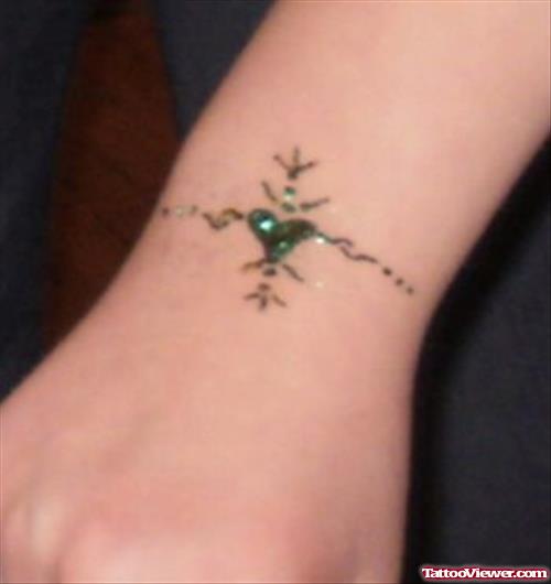 Green Heart Tattoo On Wrist