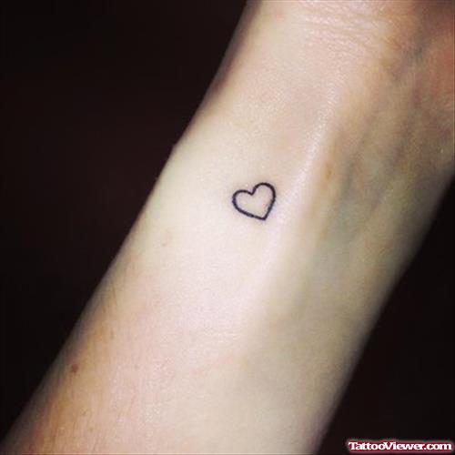 Tiny Heart Tattoo On Left Forearm