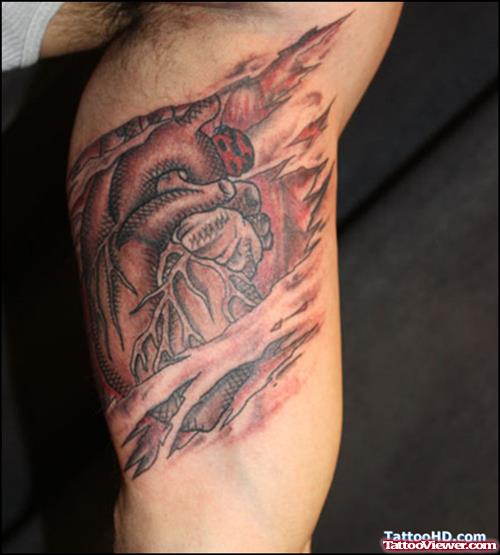 Ripped Skin Heart Tattoo On Biceps