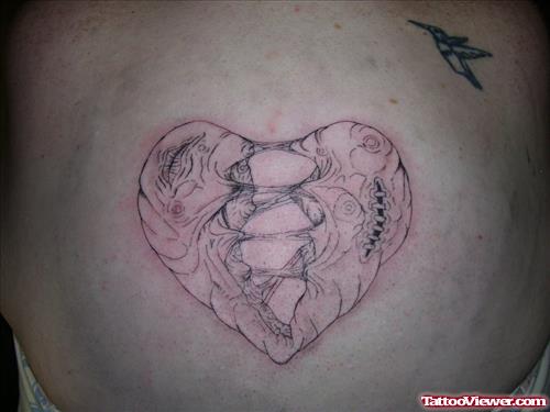 Grey Ink Heart Tattoo On Belly