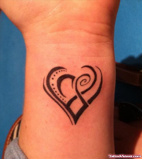 Attractive Tribal Heart Tattoo On Wrist