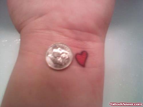 Tiny Red Heart Tattoo On Left Wrist