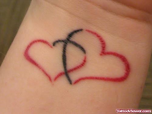 Black And Red Heart Tattoos On Wrist