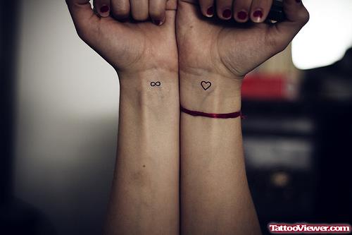 Infinity Symbol And Heart Tattoos On Wrists
