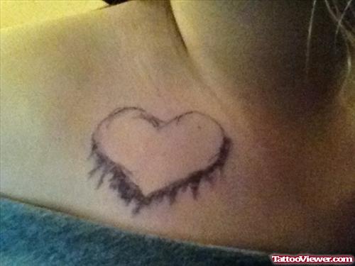 Grey Ink Heart Tattoo On Lowerback