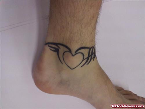 Black Tribal And Heart Tattoo On Ankle