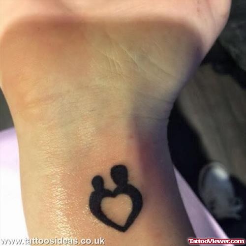 Bold Black Heart Tattoo On Wrist