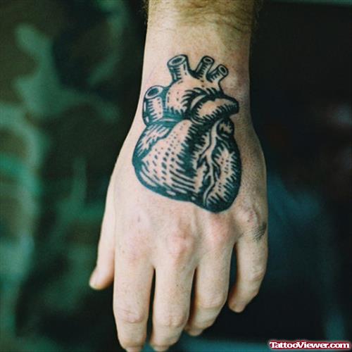 Amazing Grey Ink Human Heart Tattoo