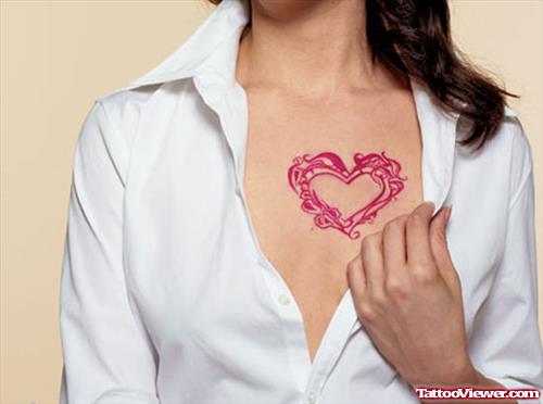 Red Ink Heart Tattoo On Chest