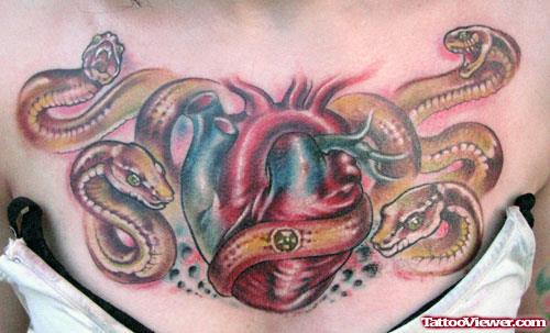 Snakes And Heart Tattoo On Chest