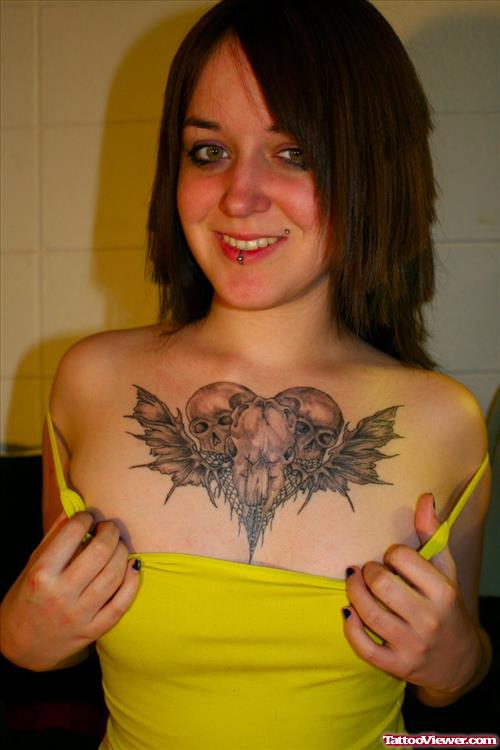 Grey Ink Winged Skull Heart Tattoo On Chest