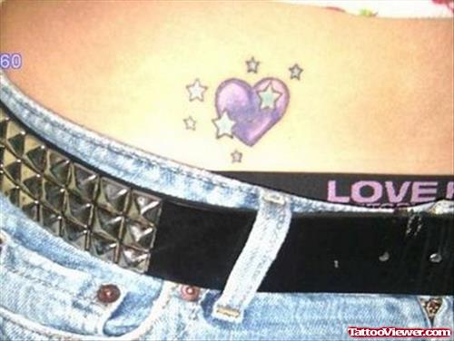 Stars And Purple Ink Heart Tattoo On Hip