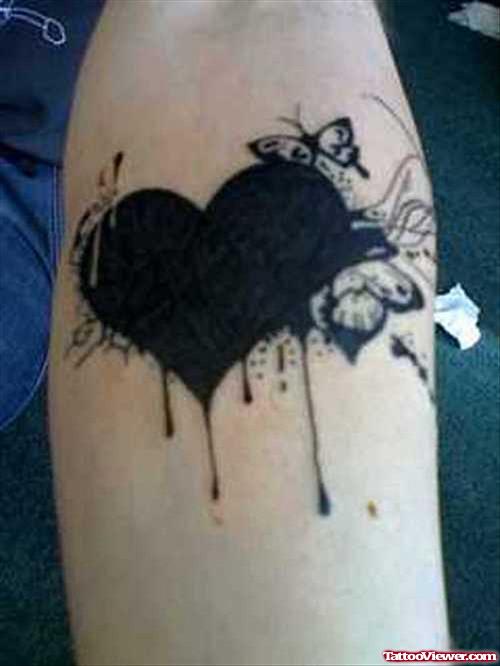 Black Heart Tattoo On Left Arm