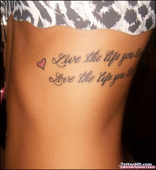 Quote And Tiny Red Heart Tattoo On Side Rib