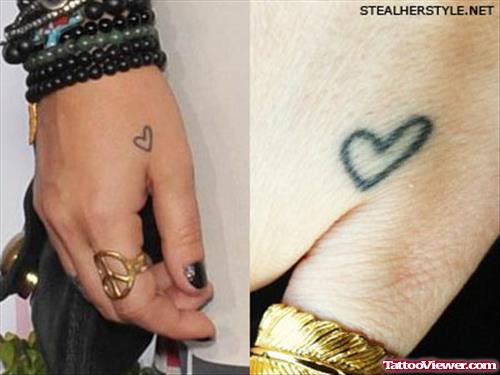 Brandi Cyrus With Heart Tattoo On Hand