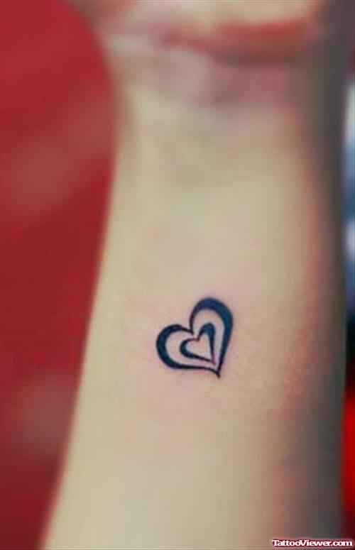 Black Heart Tattoo On Left Forearm