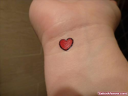 Tiny Red Heart Tattoo On Wrist