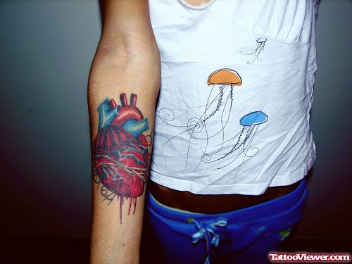 Colored Human Heart Tattoo On Right Sleeve
