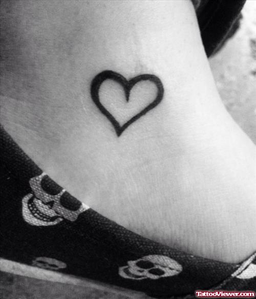 Black Ink Heart Tattoo On Ankle