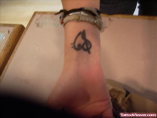 Black Heart Tattoo On Girl Wrist