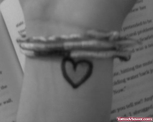 Awesome Black Heart Tattoo On Wrist
