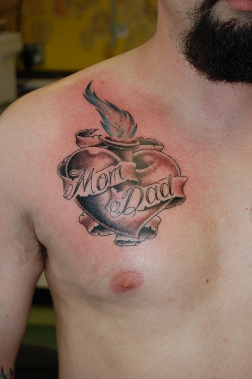 Grey Ink Sacred Heart Tattoo On Man Chest
