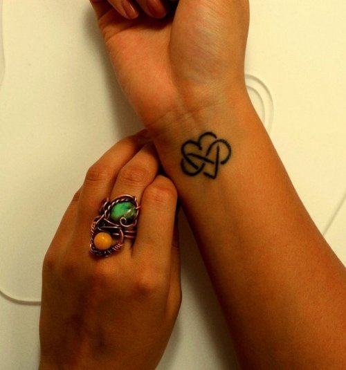 Infinity Symbol And Heart Tattoo On Right Wrist