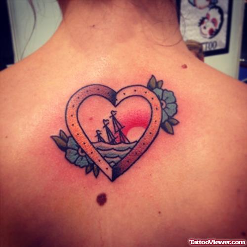 heart with ship and flowers tattoo