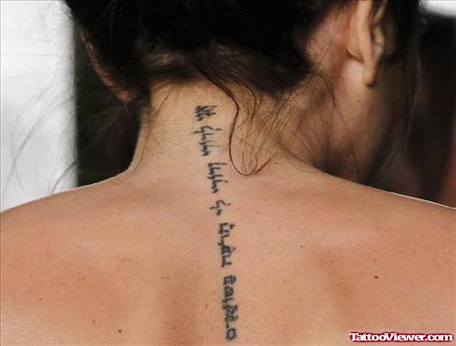 Fine Hebrew Tattoo On Girl Back