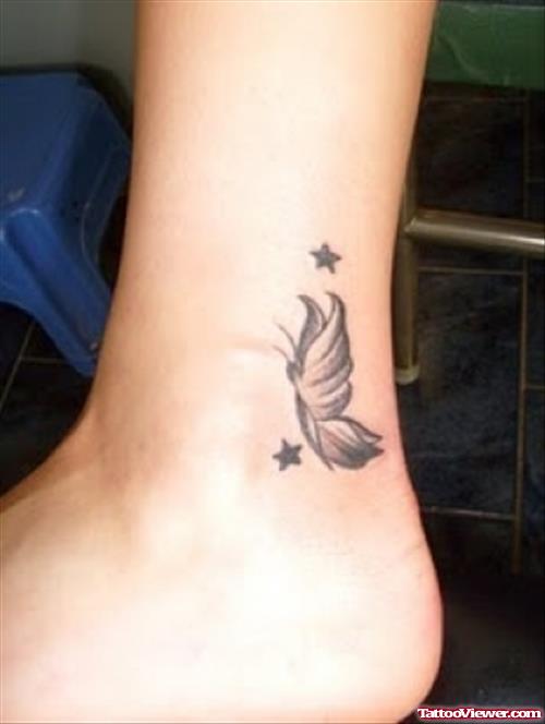 Grey Ink Stars And Butterfly Heel Tattoo
